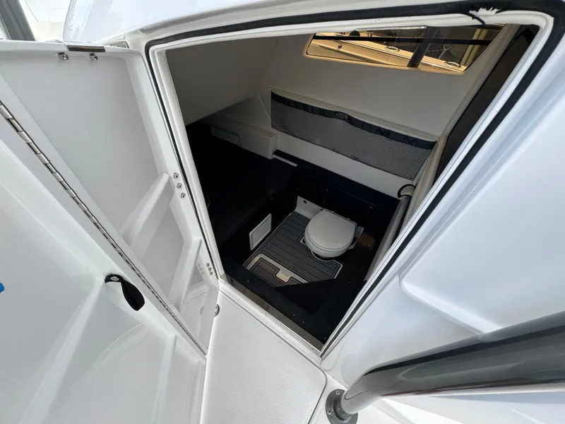 Slide: The Image of 2022 Nor-Tech 392 Super Fish boat cabin interior with toilet. - 28