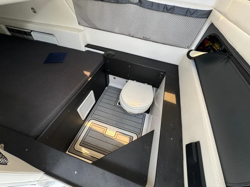 Slide: The Image of 2022 Nor-Tech 392 Super Fish cabin interior with compact marine toilet. - 29