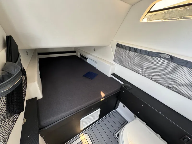 Slide: The Image of 2022 Nor-Tech 392 Super Fish cabin interior with bed and storage compartments. - 30