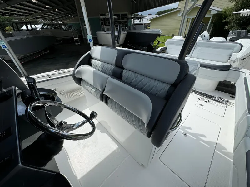 Slide: The Image of 2022 Nor-Tech 392 Super Fish boat interior with dual seating and steering wheel. - 31