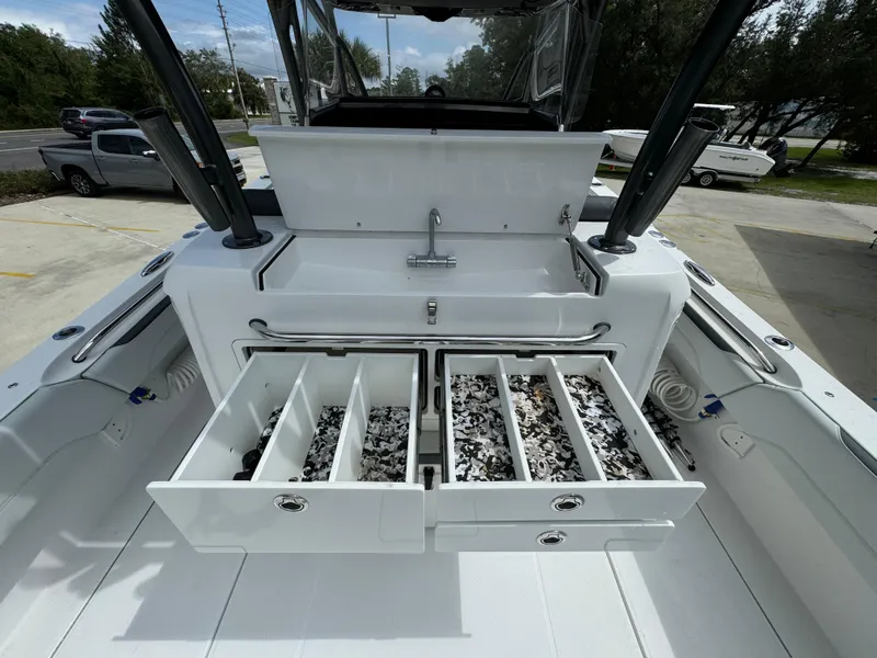Slide: The Image of 2022 Nor-Tech 392 Super Fish boat with open tackle storage drawers. - 38