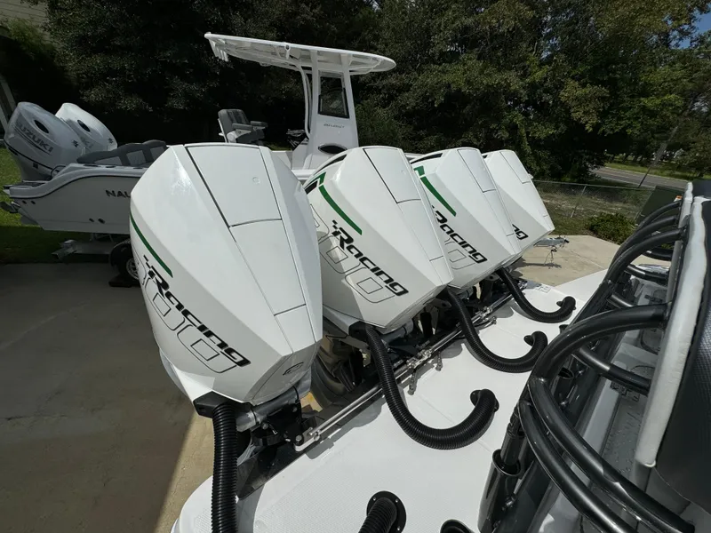 Slide: The Image of 2022 Nor-Tech 392 Super Fish with quad outboard motors, docked outdoors. - 43