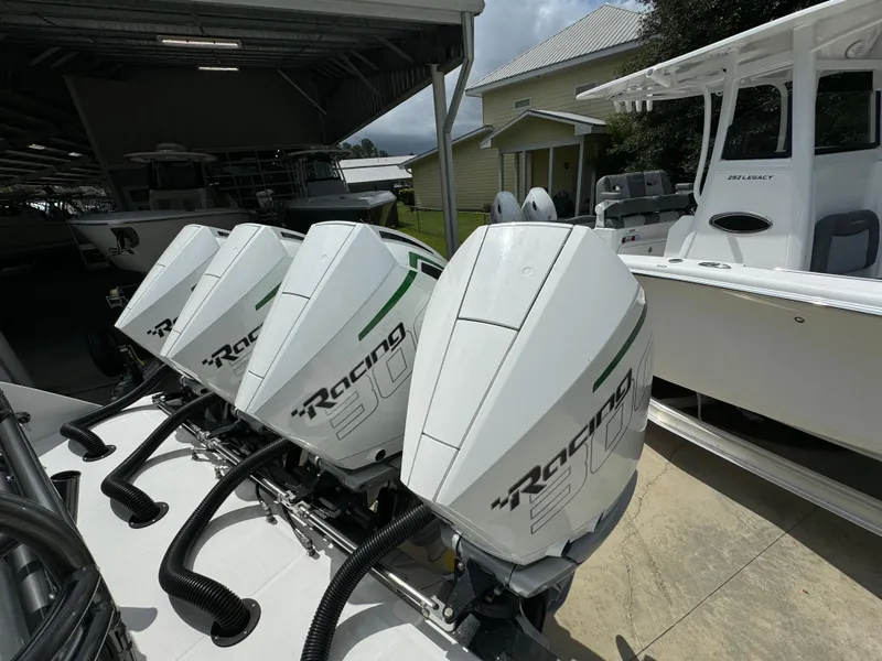 Slide: The Image of 2022 Nor-Tech 392 Super Fish with powerful outboard engines in a marina setting. - 44