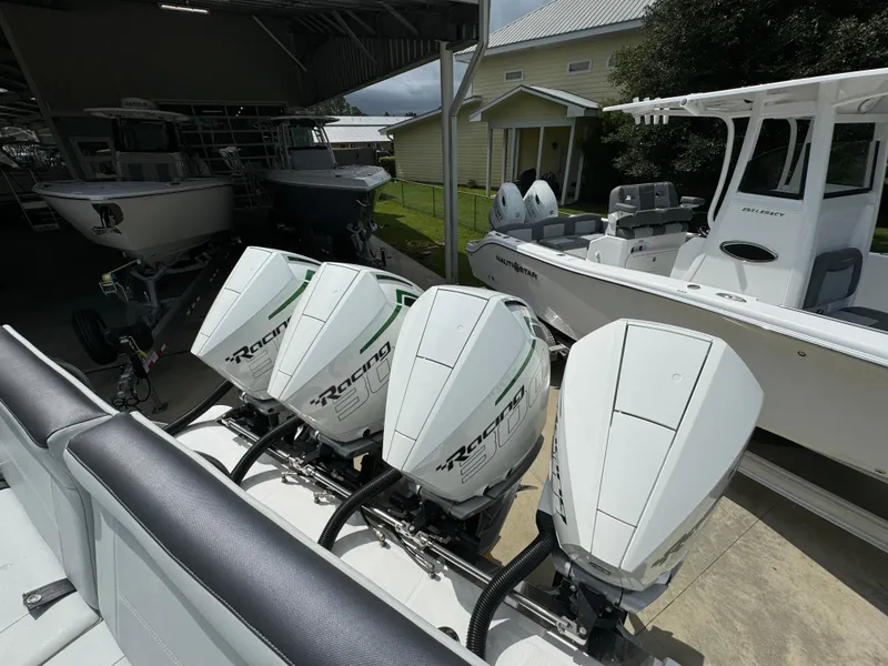 Slide: The Image of 2022 Nor-Tech 392 Super Fish with four powerful outboard engines in a boatyard. - 45