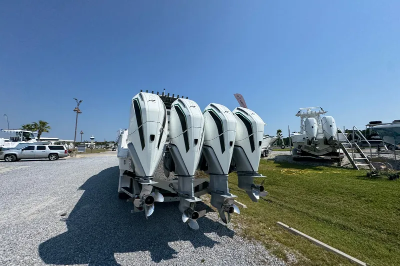 Slide: The Image of 2022 Nor-Tech 392 Super Fish boat with four powerful outboard engines. - 6