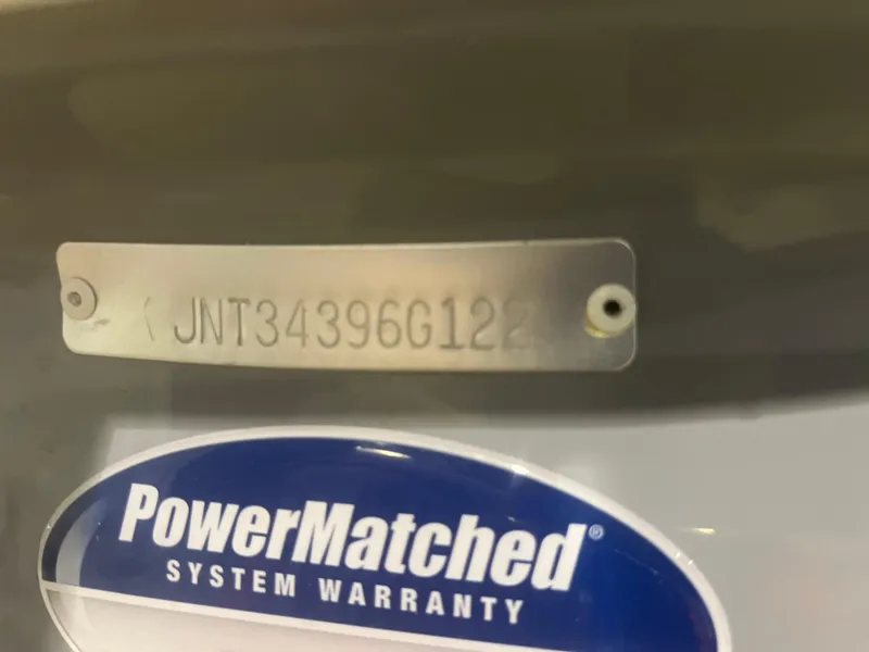 Slide: The Image of NauticStar 243 DC 2022 boat with PowerMatched system warranty label. - 28