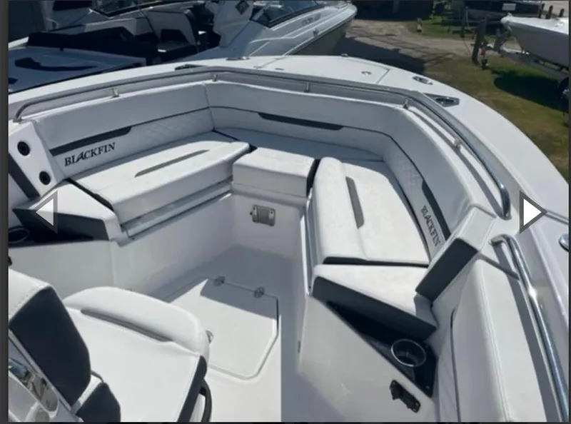 Slide: The Image of 2023 Blackfin 252 CC boat interior with white seating and sleek design. - 13
