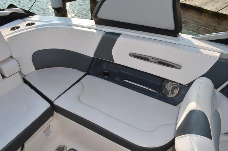 Slide: The Image of 2020 Chaparral 257 SSX boat interior with white and gray seating. - 10