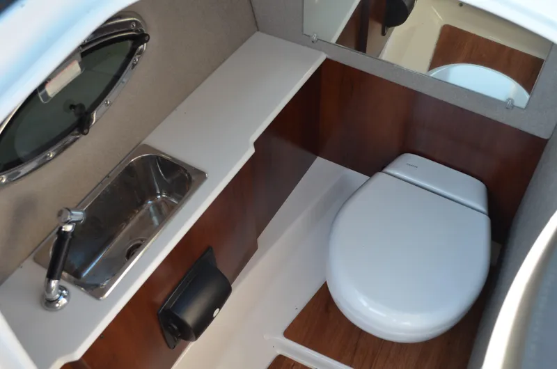 Slide: The Image of 2020 Chaparral 257 SSX boat interior with sink and toilet. - 17