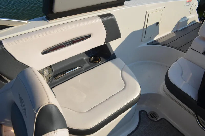 Slide: The Image of 2020 Chaparral 257 SSX boat interior seating with cup holder and sleek design. - 6