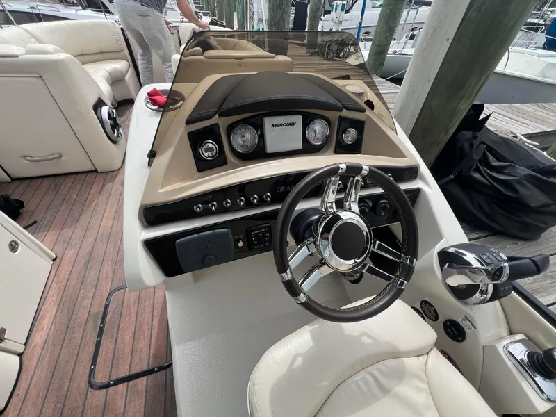 Slide: The Image of 2015 Harris FloteBote Grand Mariner SL 250 helm with steering wheel and controls. - 10