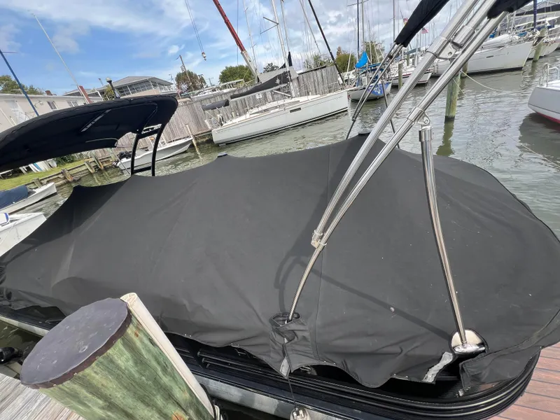 Slide: The Image of 2015 Harris FloteBote Grand Mariner SL 250 covered at marina dock. - 33