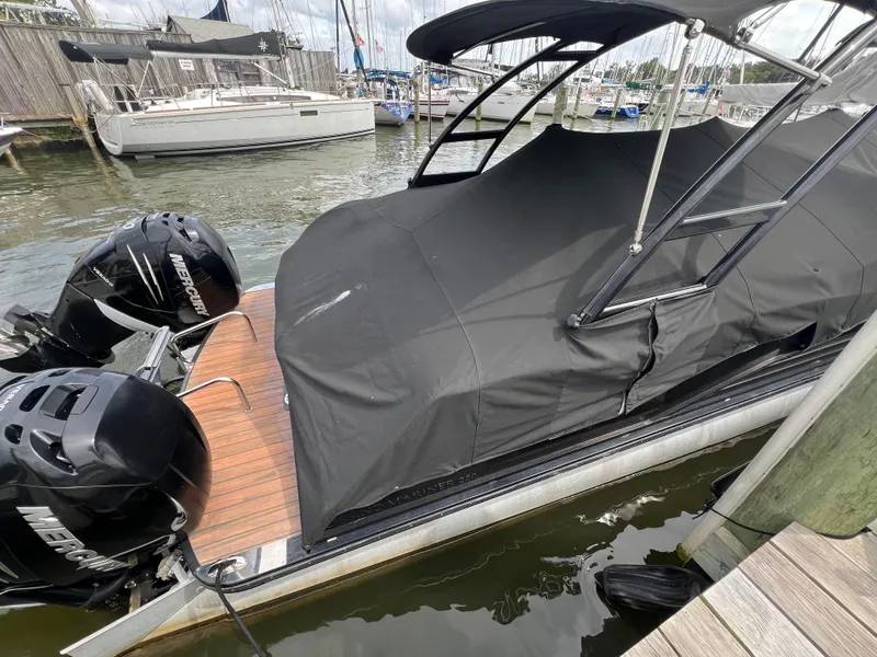 Slide: The Image of 2015 Harris FloteBote Grand Mariner SL 250 covered at marina with Mercury engines. - 34
