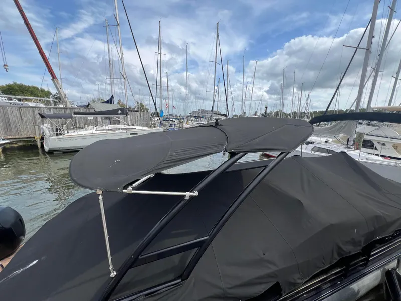 Slide: The Image of 2015 Harris FloteBote Grand Mariner SL 250 with black canopy in marina setting. - 35