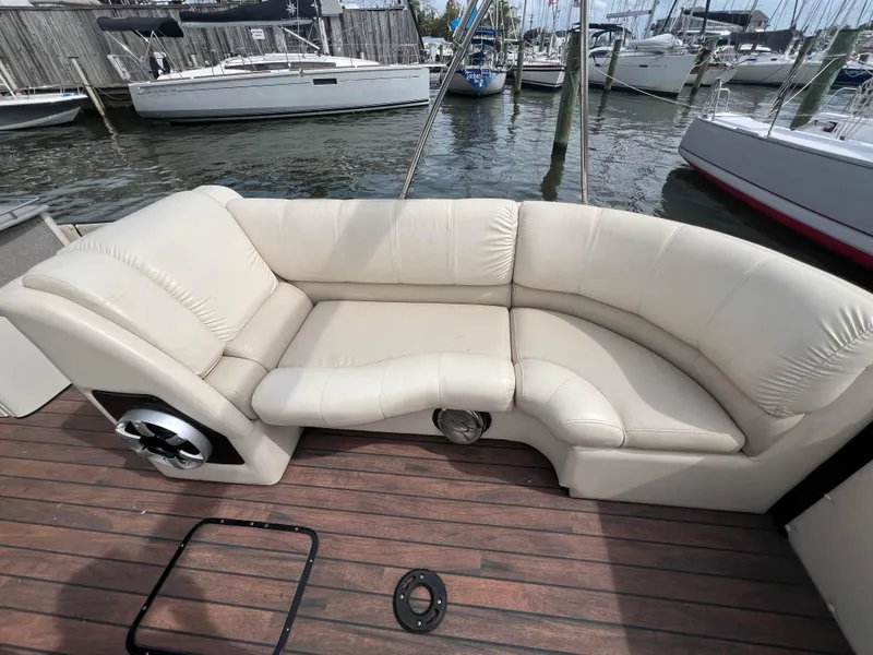 Slide: The Image of 2015 Harris FloteBote Grand Mariner SL 250 with beige seating, docked at marina. - 38