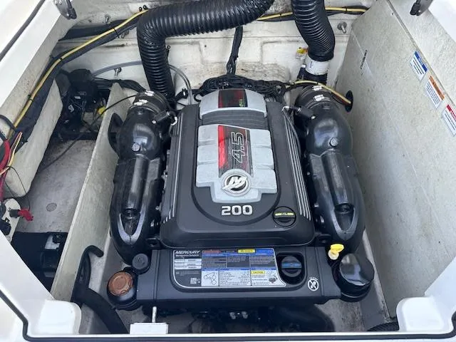 Slide: The Image of 2018 Bayliner VR6 Bowrider I/O engine compartment with Mercury 4.5L 200 HP engine. - 15