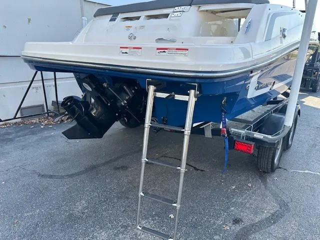 Slide: The Image of 2018 Bayliner VR6 Bowrider I/O on trailer, rear view with ladder and outboard motor. - 3