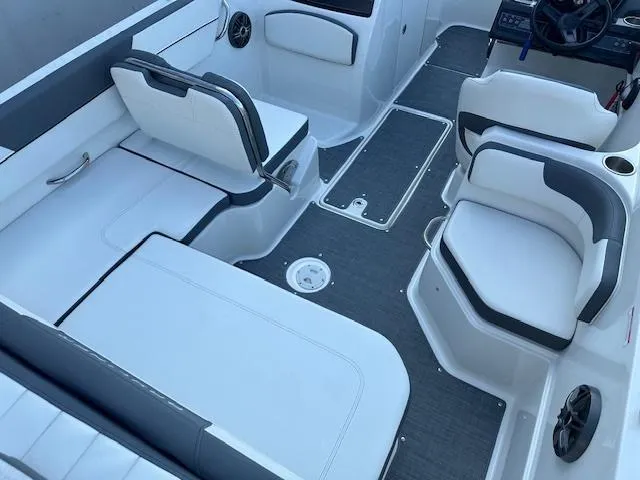 Slide: The Image of 2018 Bayliner VR6 Bowrider I/O interior with white seating and modern design. - 5