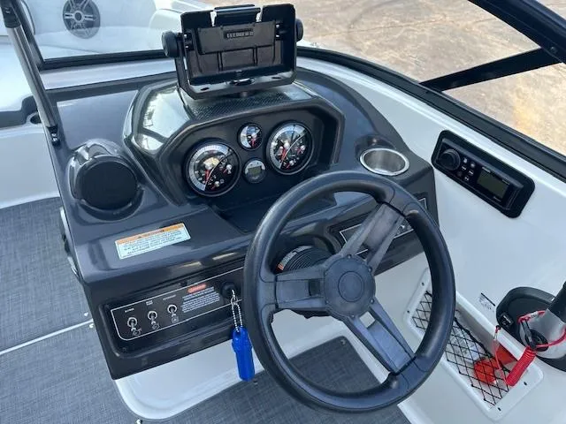 Slide: The Image of 2018 Bayliner VR6 Bowrider I/O dashboard with steering wheel and instrument panel. - 8