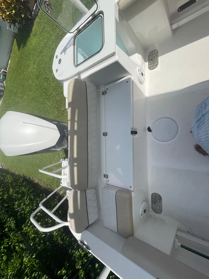 Slide: The Image of 2021 Sea Fox 248 Commander boat interior with seating and engine view. - 11