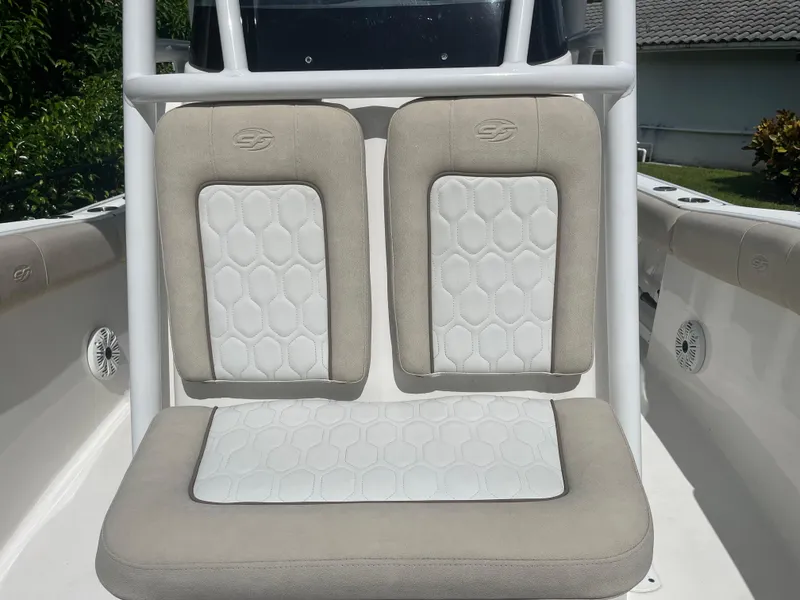 Slide: The Image of 2021 Sea Fox 248 Commander boat seats with beige and white hexagonal pattern. - 6