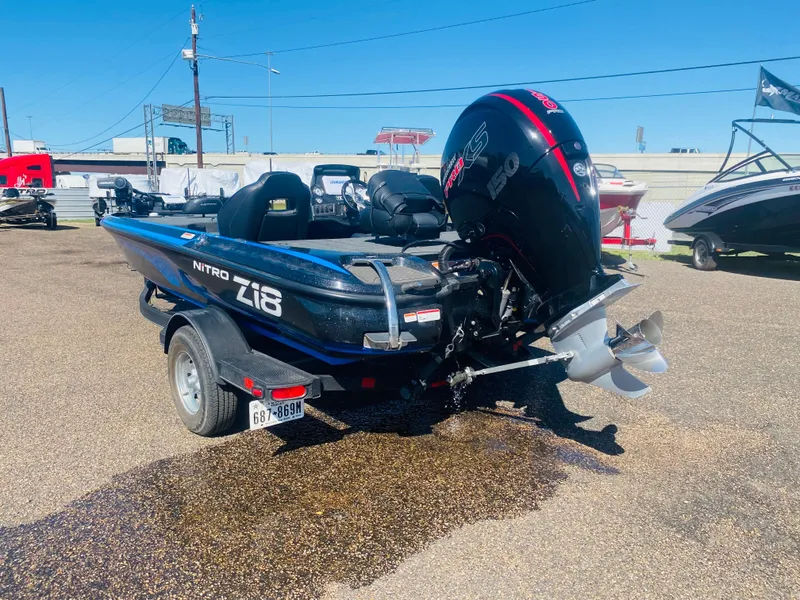 Slide: The Image of 2023 Nitro Z18 boat with powerful outboard motor on a trailer. - 3