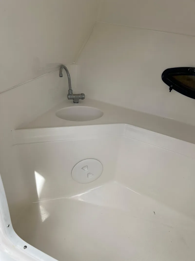 Slide: The Image of 2011 Hurricane SUNDECK SPORT 220 boat interior with sink and faucet. - 17