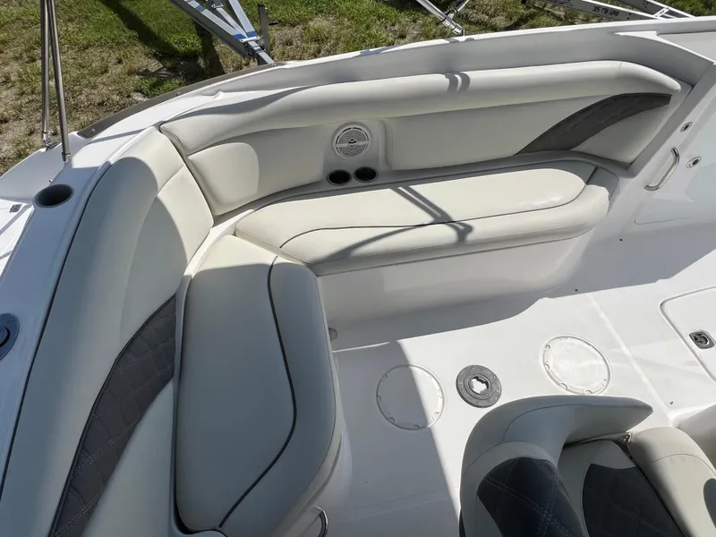 Slide: The Image of 2011 Hurricane SUNDECK SPORT 220 boat interior with white cushioned seating. - 18