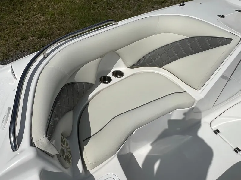 Slide: The Image of 2011 Hurricane SUNDECK SPORT 220 boat interior with cushioned seating and cup holders. - 19