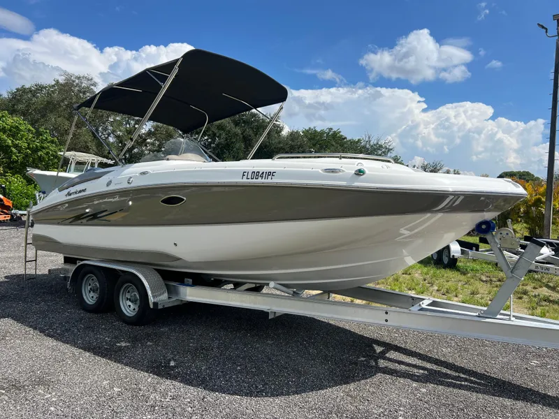 Slide: The Image of 2011 Hurricane SUNDECK SPORT 220 boat on trailer under blue sky. - 2