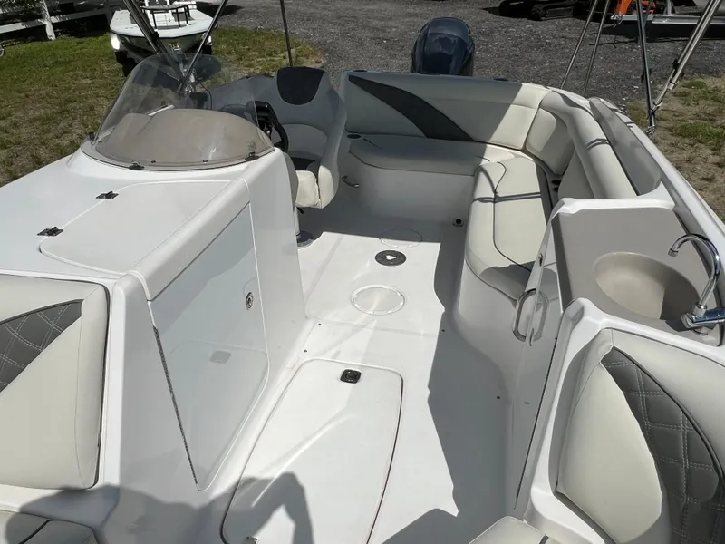 Slide: The Image of 2011 Hurricane SUNDECK SPORT 220 boat interior with spacious seating and modern design. - 21