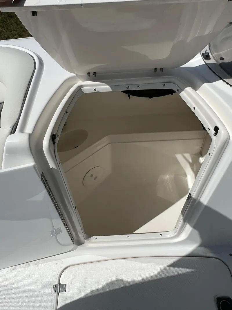 Slide: The Image of Open storage compartment on 2011 Hurricane SUNDECK SPORT 220 boat. - 26
