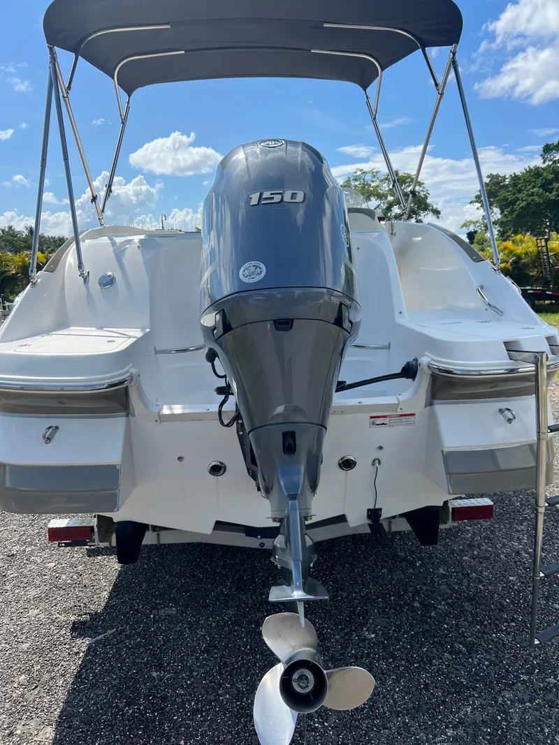 Slide: The Image of 2011 Hurricane SUNDECK SPORT 220 boat with 150 HP outboard motor. - 29