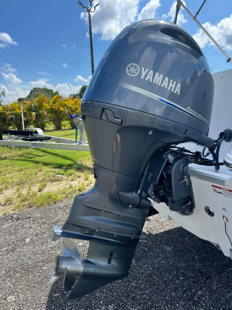 Slide: The Image of Yamaha outboard motor on 2011 Hurricane SUNDECK SPORT 220 boat, sunny day background. - 35