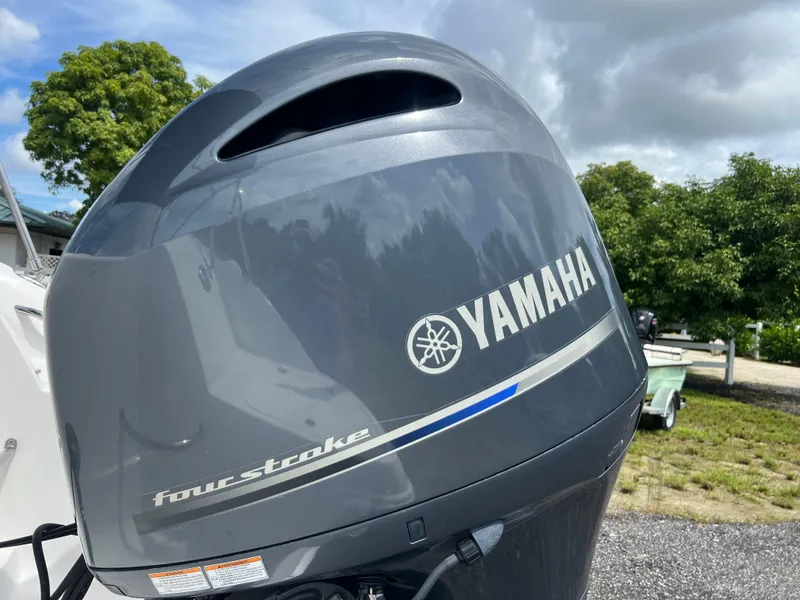 Slide: The Image of Yamaha four-stroke engine on 2011 Hurricane SUNDECK SPORT 220 boat, outdoors. - 36