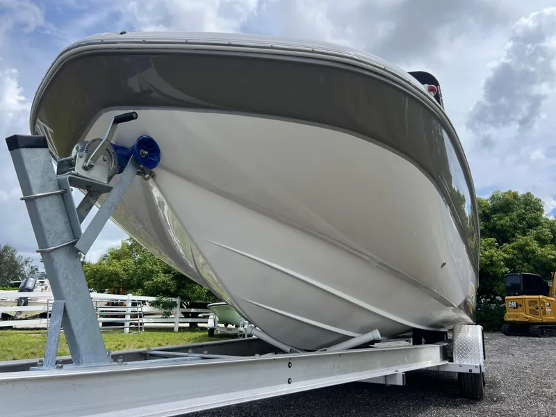 Slide: The Image of 2011 Hurricane SUNDECK SPORT 220 boat on trailer, parked outdoors. - 6