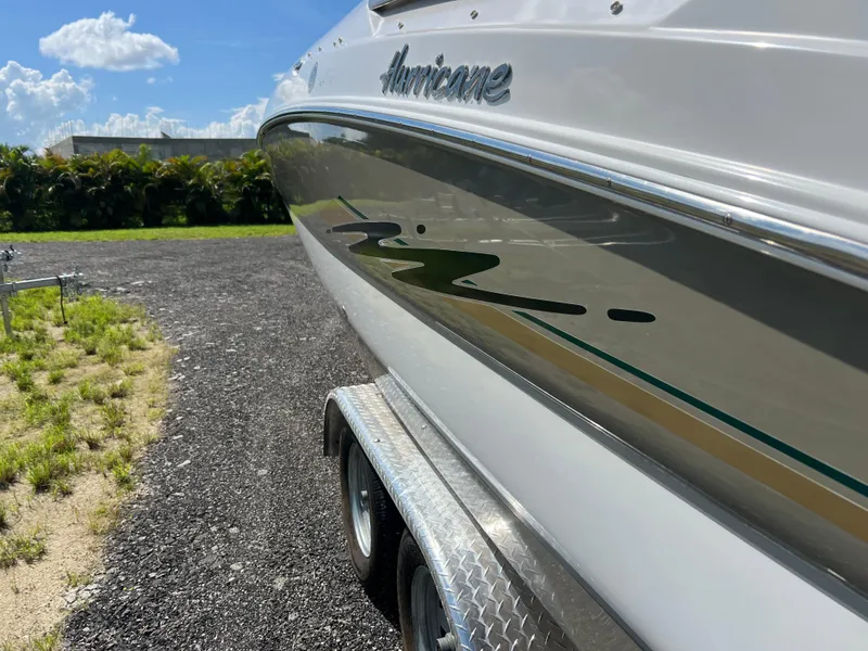 Slide: The Image of 2011 Hurricane SUNDECK SPORT 220 boat on trailer, sunny day, grassy background. - 7
