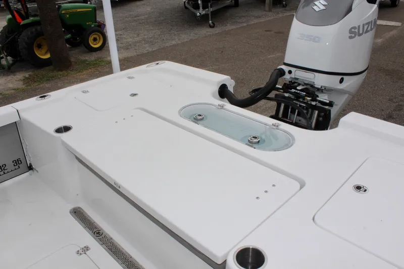 Slide: The Image of 2025 Sea Pro 250 Bay boat with Suzuki engine, featuring spacious deck layout. - 10