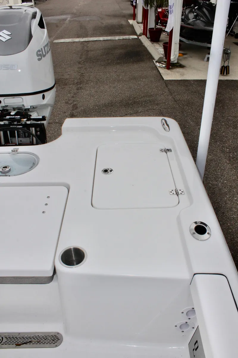 Slide: The Image of 2025 Sea Pro 250 Bay boat deck with Suzuki outboard motor. - 11