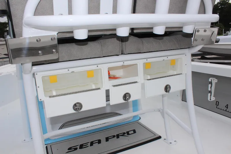 Slide: The Image of 2025 Sea Pro 250 Bay boat storage compartments and seating area. - 18
