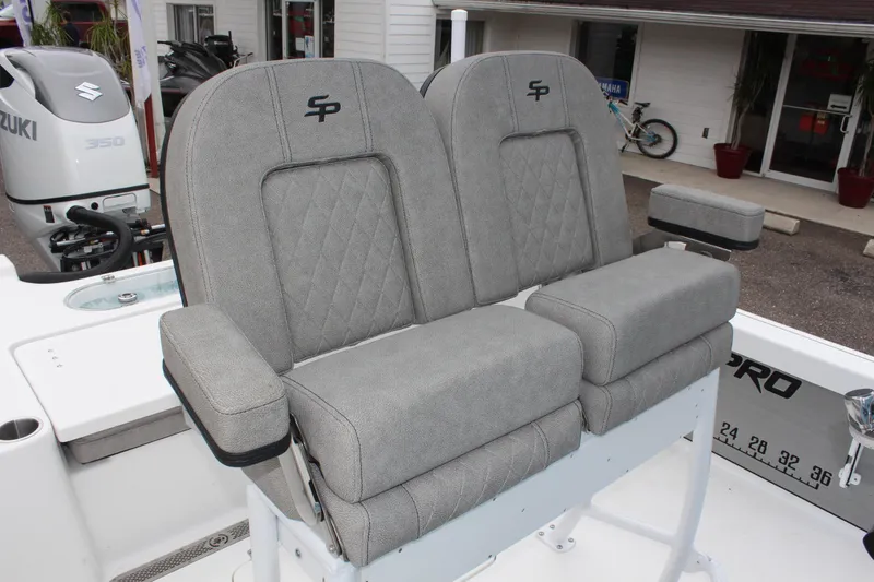 Slide: The Image of 2025 Sea Pro 250 Bay boat seats with gray upholstery and armrests. - 24
