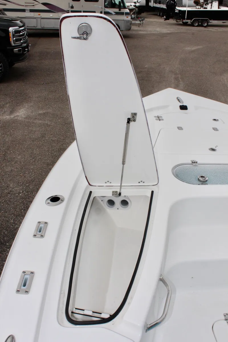 Slide: The Image of 2025 Sea Pro 250 Bay boat with open storage compartment on deck. - 30