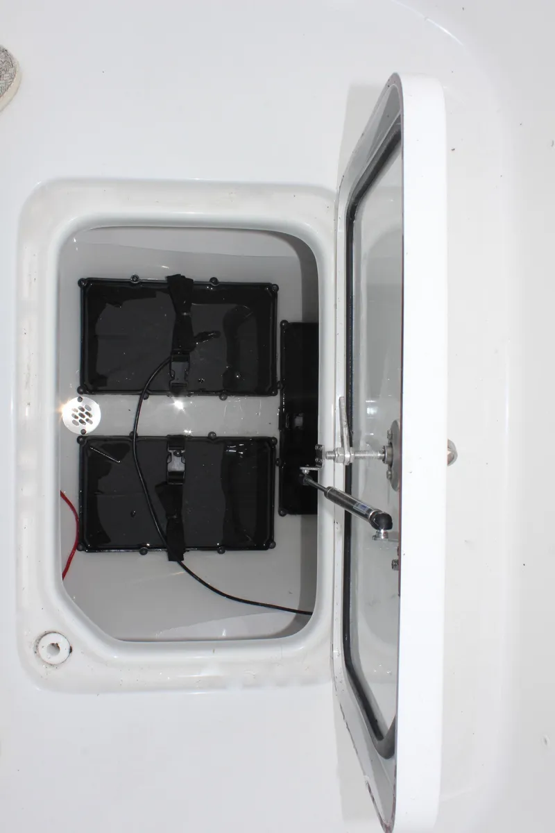 Slide: The Image of 2025 Sea Pro 250 Bay boat battery compartment with dual batteries. - 31