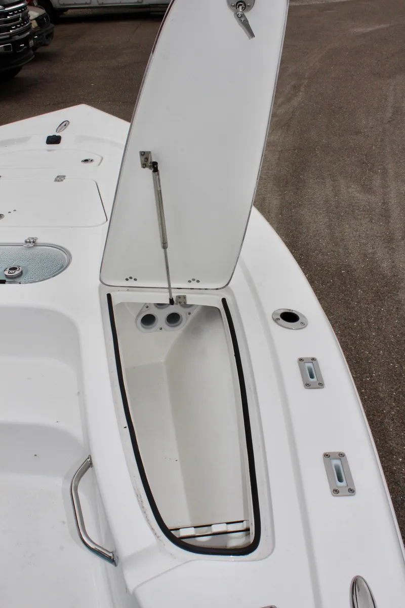 Slide: The Image of 2025 Sea Pro 250 Bay boat storage compartment with open hatch. - 32