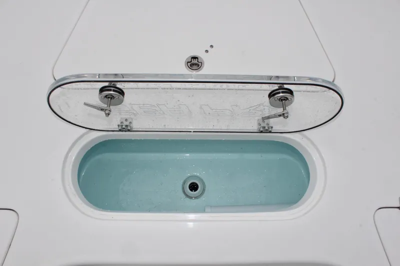 Slide: The Image of Livewell compartment on 2025 Sea Pro 250 Bay boat, open with clear lid. - 33