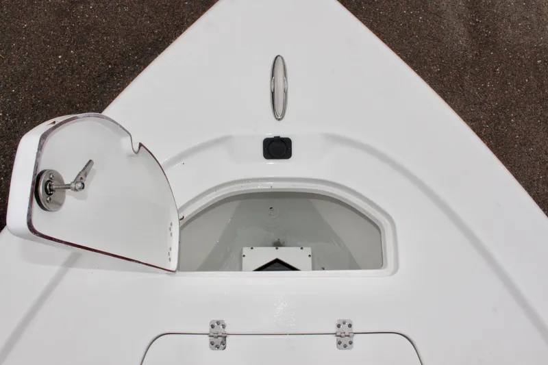 Slide: The Image of 2025 Sea Pro 250 Bay boat storage compartment with open hatch. - 35