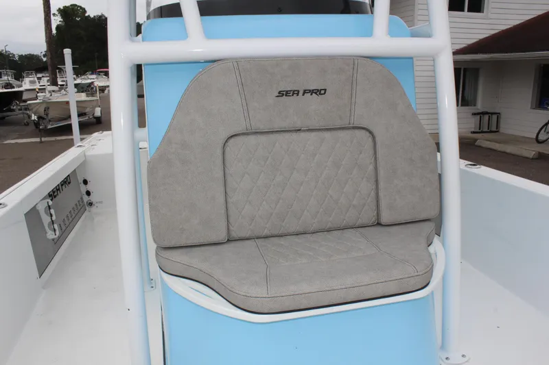 Slide: The Image of 2025 Sea Pro 250 Bay boat seat with gray upholstery and logo. - 37