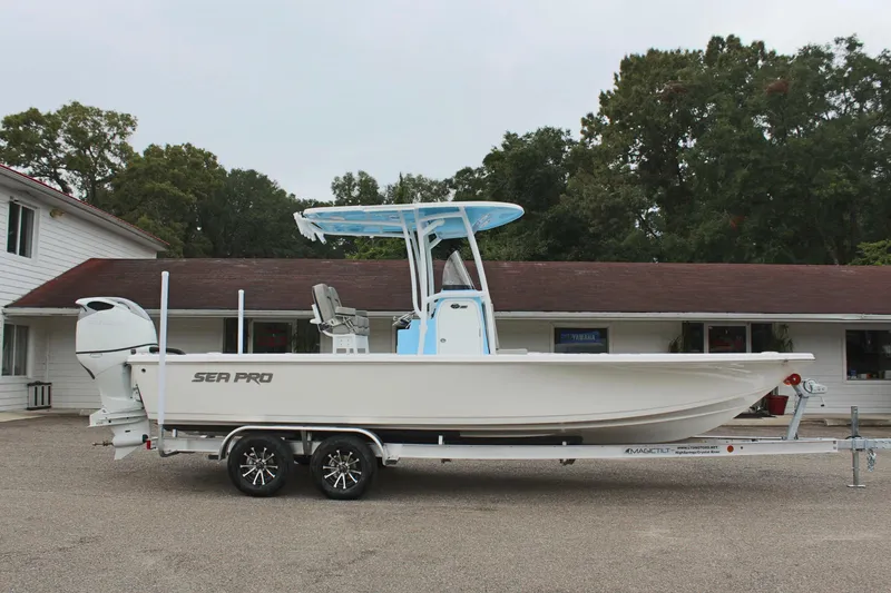Slide: The Image of 2025 Sea Pro 250 Bay boat on trailer, parked outdoors. - 5