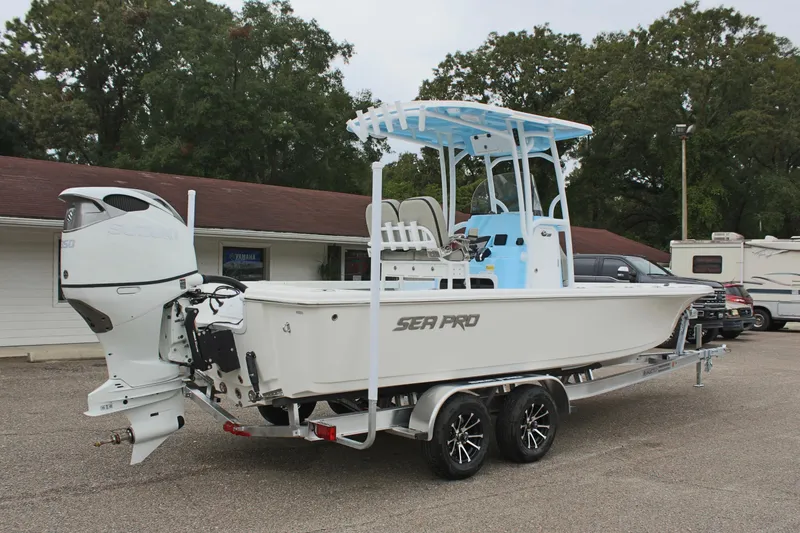 Slide: The Image of 2025 Sea Pro 250 Bay boat on trailer, parked outdoors. - 6