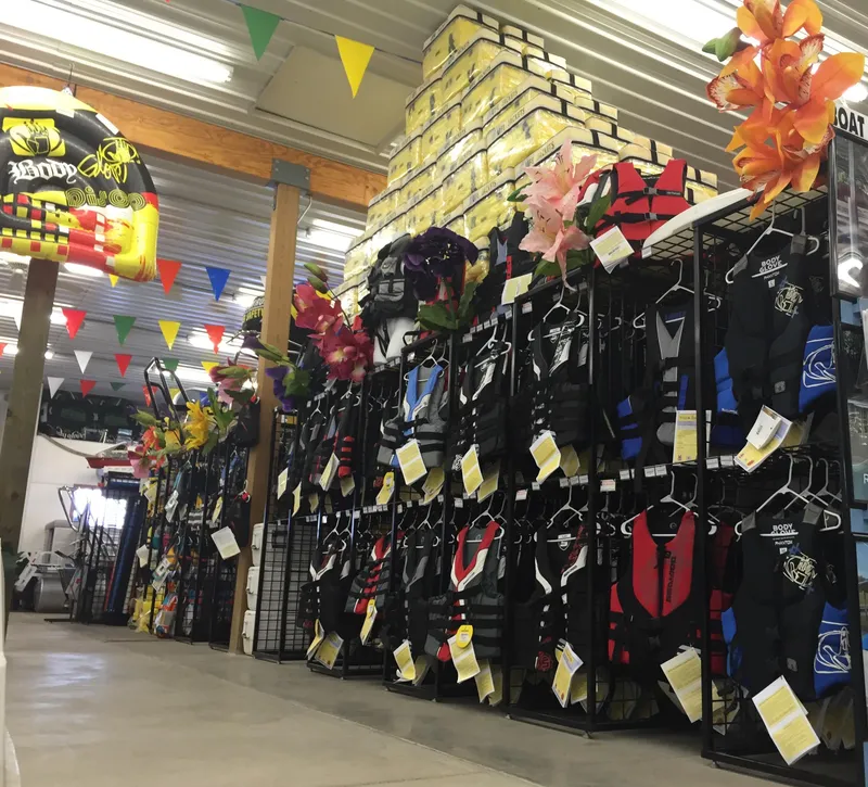 Slide: The Image of Store interior with colorful life jackets and boating accessories on display. - 18